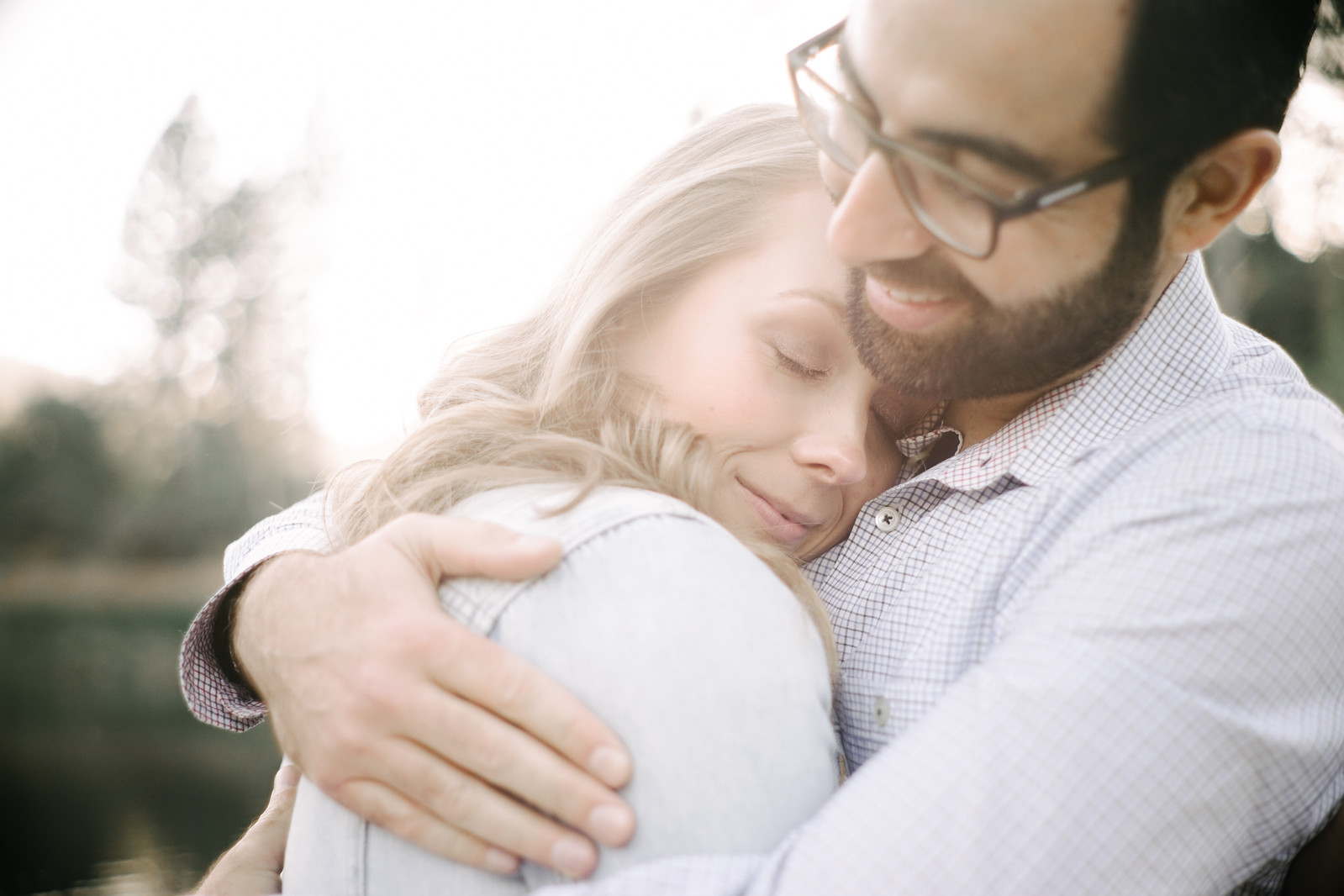 Couple lovingly embrace during sunset